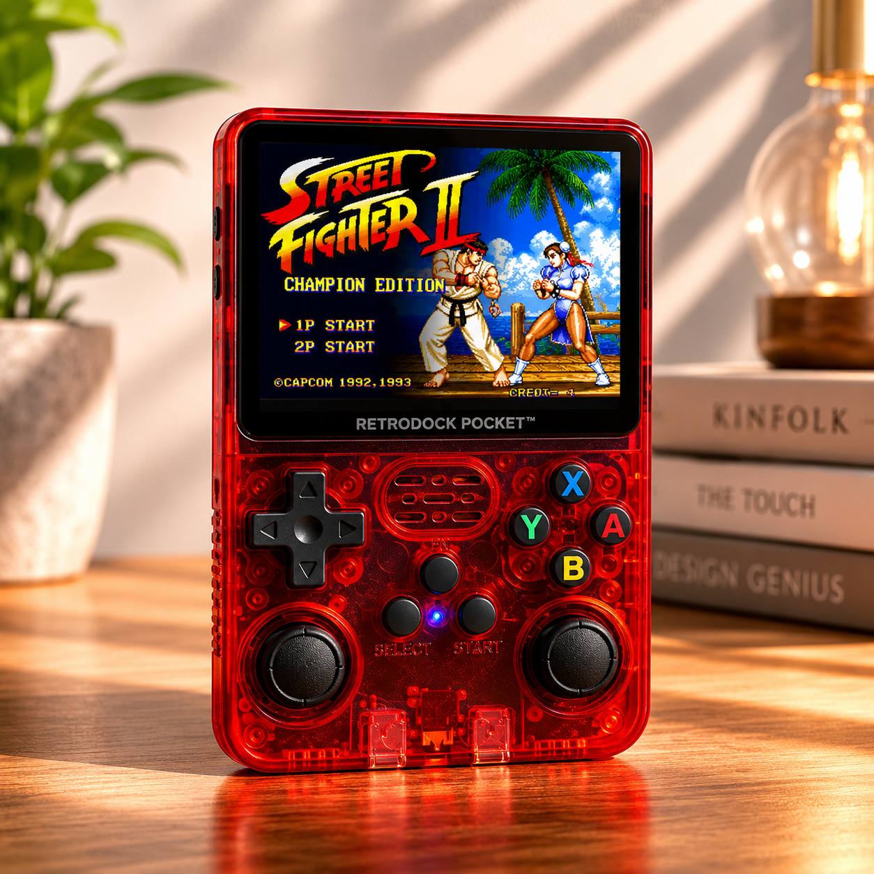 Handheld gaming console with Street Fighter II display on a wooden surface.